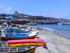 Boats arranged on the beach in Paita, Peru.